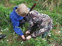 Youngsters (camouflaged!) planting seedling